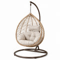 Sillón colgante de ratán sintético y acero con cojín beige