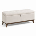 Banco de almacenamiento de tela beige con estructura de madera
